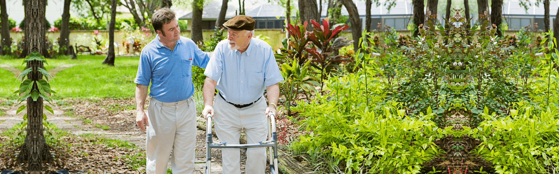 elderly man assisted by a caregiver